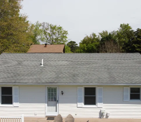 A residential roof before rejuvenation chemical treatment